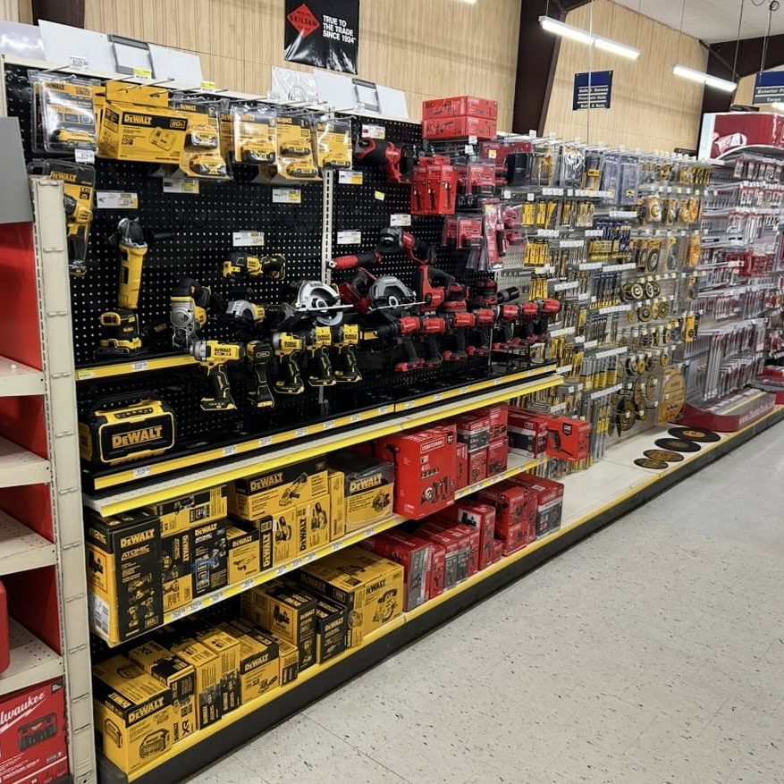 Hardware store aisle with tools on display.