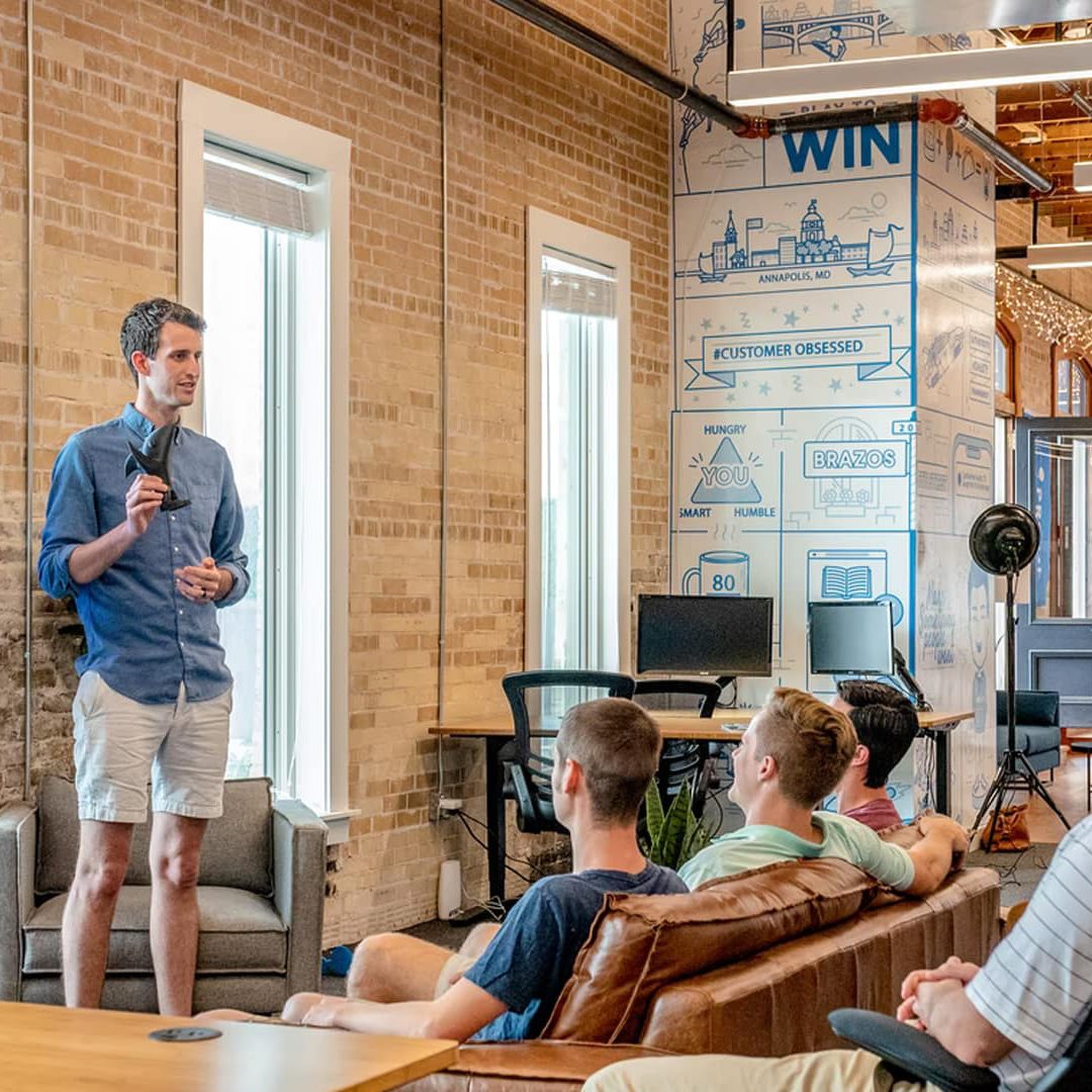 Innovative warehouse distribution process at Emery Jensen Distributing in a modern, industrial-style space with team collaboration.